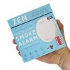 Interconnected smoke alarms - ZEN single box being held by a hand
